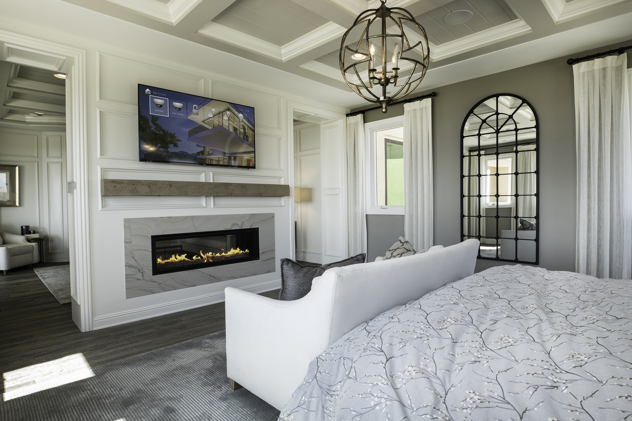 bedroom with a tv showing a control4 interface